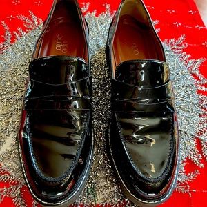 Black loafer/ lug sole. Man made material. Sz 10